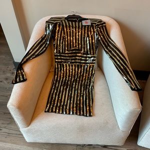 Brand New…never worn. Black and gold sequence mini dress with tags.